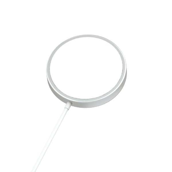Slim magnetic wireless charging pad on tabletop with smartphone