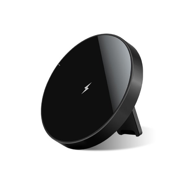 Magnetic wireless charging stand holding phone upright on desk
