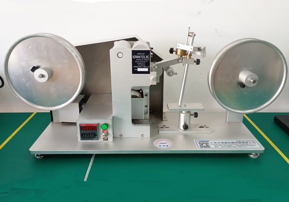 RCA tape abrasion tester checking the surface wear resistance and custom logo of wireless charger housings